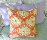 Bright orange and pink ikat pillow cover