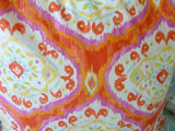 Bright orange and pink ikat pillow cover