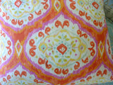 Bright orange and pink ikat pillow cover