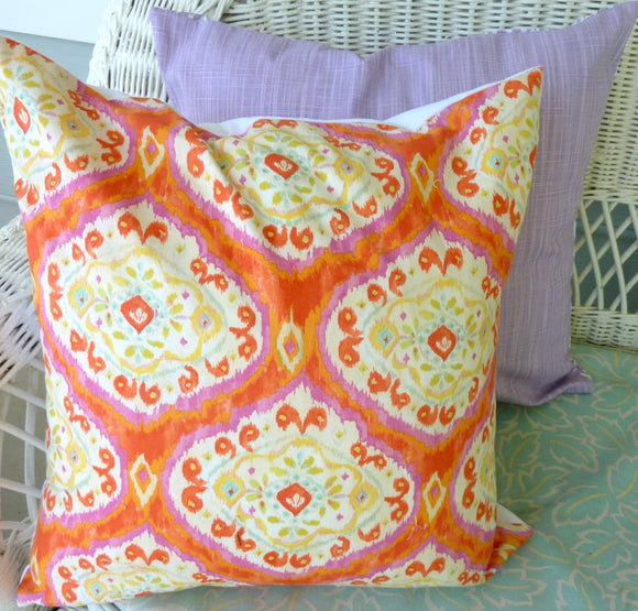 Bright orange and pink ikat pillow cover